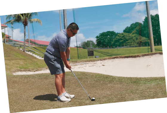 A man is playing golf on a grassy course. AI generated content