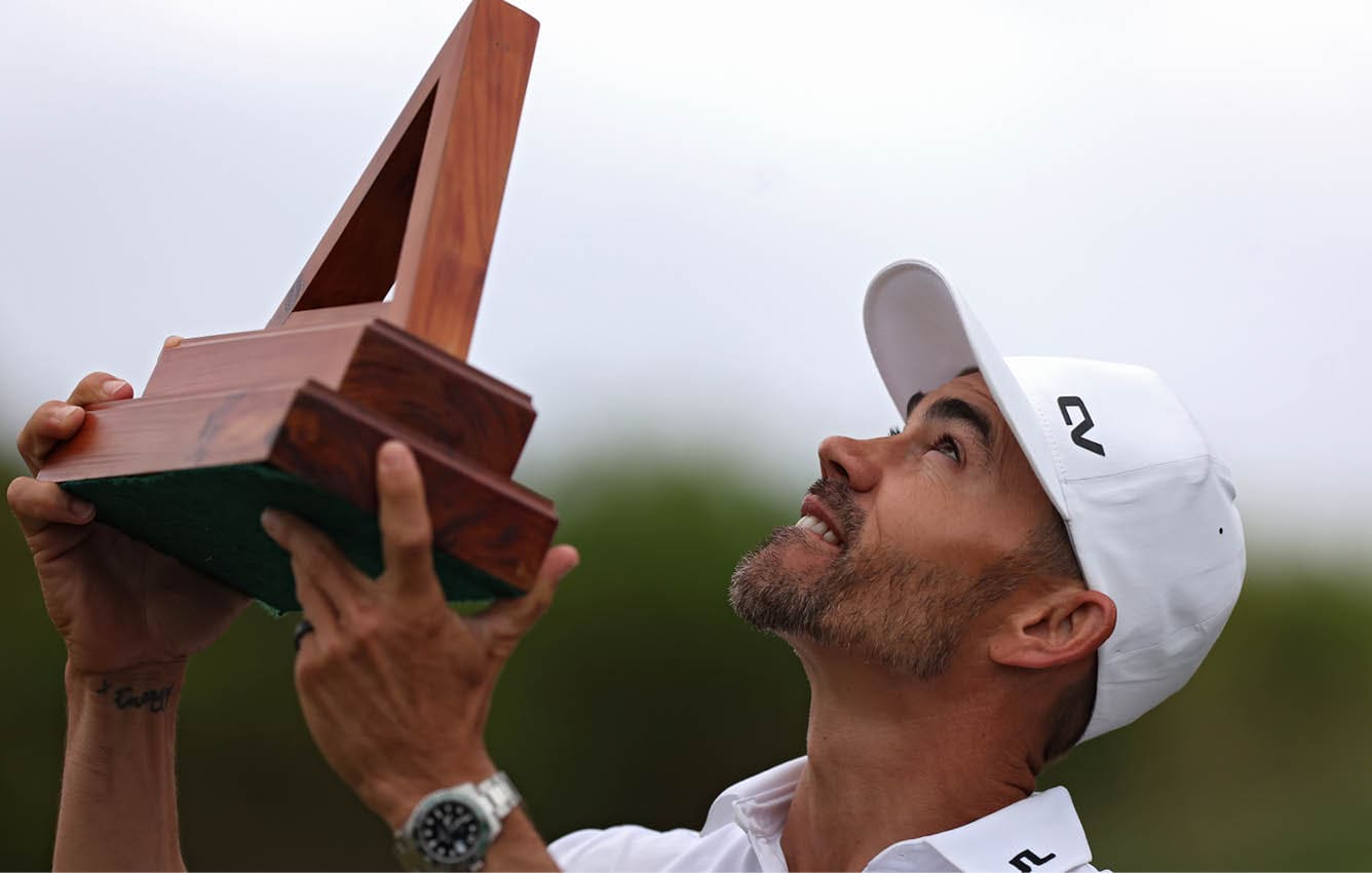 SOUTHAMPTON, BERMUDA - NOVEMBER 12: Camilo Villegas of Colombia celebrates looks skyward with the trophy after winning the Butterfield Bermuda Championship at Port Royal Golf Course on November 12, 2023 in Southampton, Bermuda. (Photo by Marianna Massey/Getty Images)