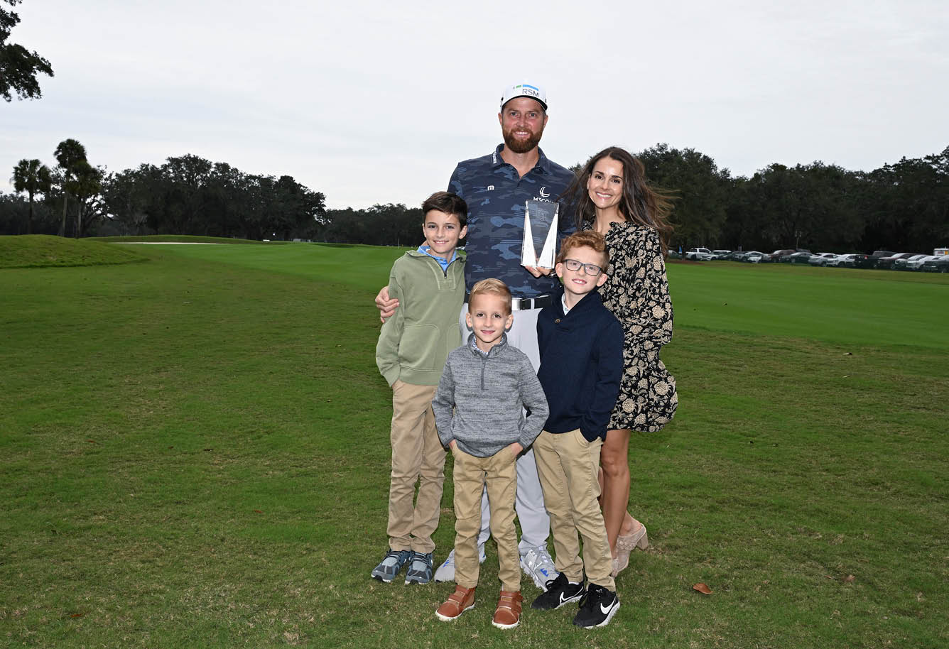 ST. SIMONS ISLAND, GEORGIA - NOVEMBER 14: Chris Kirk poses with his family as he receives the Courage Award prior to the RSM Classic at Sea Island Golf Club on November 14, 2023 in St. Simons Island, Georgia. (Photo by Tracy Wilcox/PGA TOUR via Getty Images)