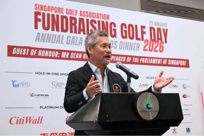 A man in a suit is speaking at a podium during a golf event. AI generated content